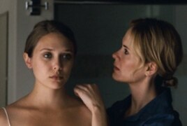 Elizabeth Olsen (left) and Sarah Paulson, as the sister who takes her in, in "Martha Marcy May Marlene."