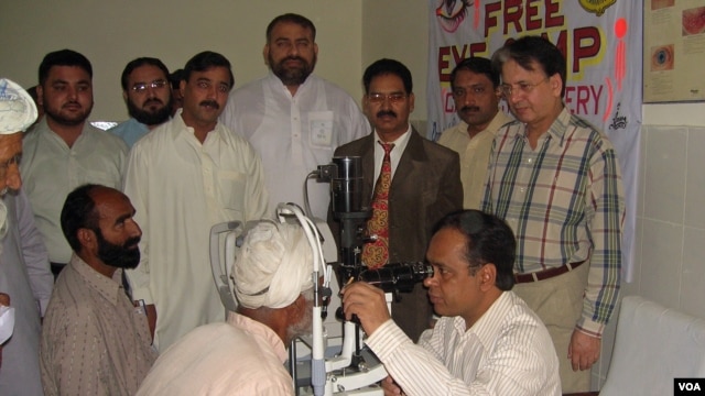Dr. Ghulam Hussain Asif examines patients during a free clinic.