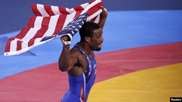 Jordan Burroughs of U.S. celebrates after defeating Iran's Sadegh Saeed Goudarzi in the final of the men's 74Kg freestyle wrestling at the ExCel venue during the London 2012 Olympic Games, August 10, 2012.