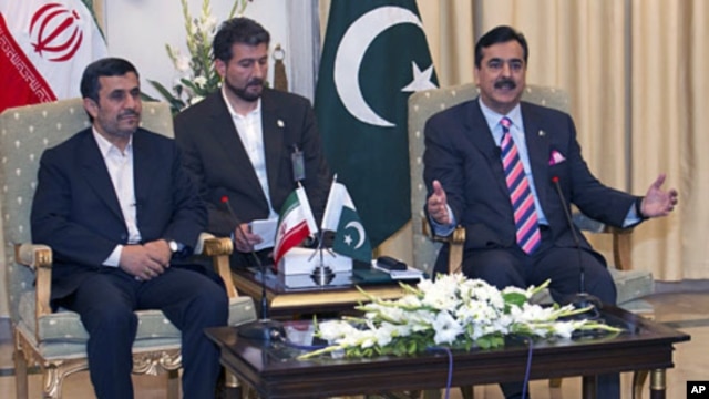 Pakistan's Prime Minister Yousuf Raza Gilani (R) holds meeting with visiting Iranian President Mahmoud Ahmadinejad at the prime minister's house in Islamabad, Pakistan, February 16, 2012.