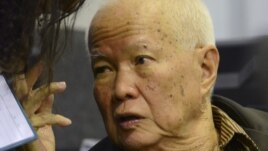 In this photo released by the Extraordinary Chambers in the Courts of Cambodia, Khieu Samphan, a former head of state for the Khmer Rouge, gestures as testimony is given during his trial at the U.N.-backed war crimes tribunal in Phnom Penh, file photo. 