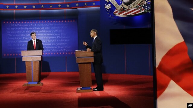 Republican presidential nominee Mitt Romney (l) debates President Barack Obama at the University of Denver, Oct. 3, 2012, in Denver