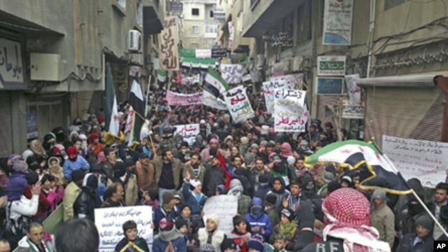 Demonstrators gather during a protest against Syria's President Bashar al-Assad after Friday prayers in Yabroud near Damascus March 2, 2012.