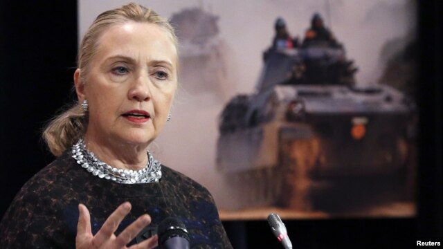 U.S. Secretary of State Hillary Clinton addresses a news conference during a NATO foreign ministers meeting in Brussels, Belgium, December 5, 2012. 