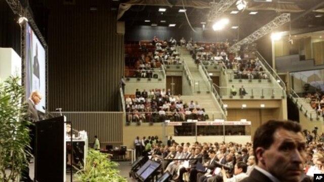 South African President Jacob Zuma, left back, speaks during the opening ceremony of the second week of climate change conference in Durban, South Africa, December 6, 2011.