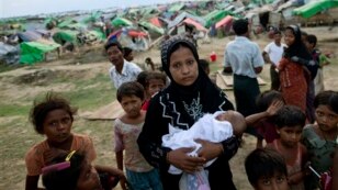 An internally displaced Rohingya woman holds her newborn baby. (file)