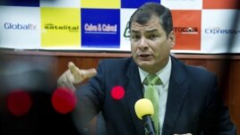 Ecuador's President Rafael Correa gestures during an interview in Loja, Ecuador, August 17, 2012.