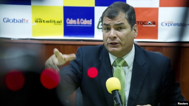 Ecuador's President Rafael Correa gestures during an interview in Loja, Ecuador, August 17, 2012.