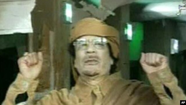 This image broadcast on Libyan state television Feb. 22, 2011, shows Libyan leader Moammar Gadhafi as he addresses the nation in Tripoli