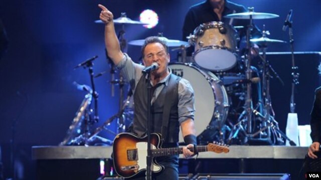 Bruce Springsteen performing at the 12-12-12  Concert for Sandy Relief at Madison Square Garden. 