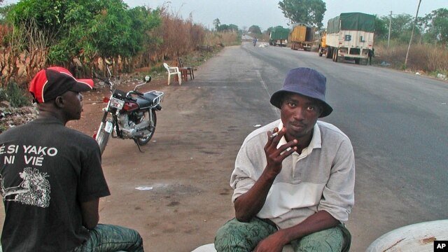 A truck driver takes a break on the line that separates northern rebel-held Ivory Coast from the government-run south (file photo)
