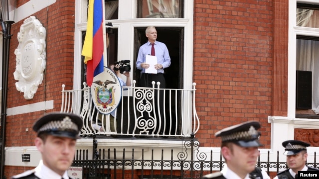 WikiLeaks founder Julian Assange steps onto the balcony before speaking to the media outside the Ecuador embassy in west London, August 19, 2012.