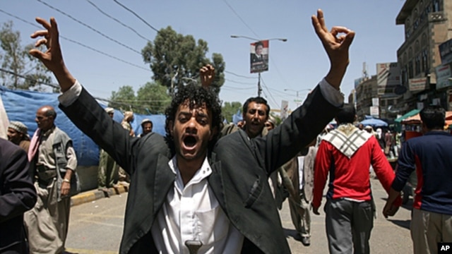 A Yemeni anti-government protester flashes the V for 'victory' sign ahead of funeral of those killed following three days of clashes between rival troops and attacks on anti-regime protesters in Sana'a, Sep, 21, 2011.