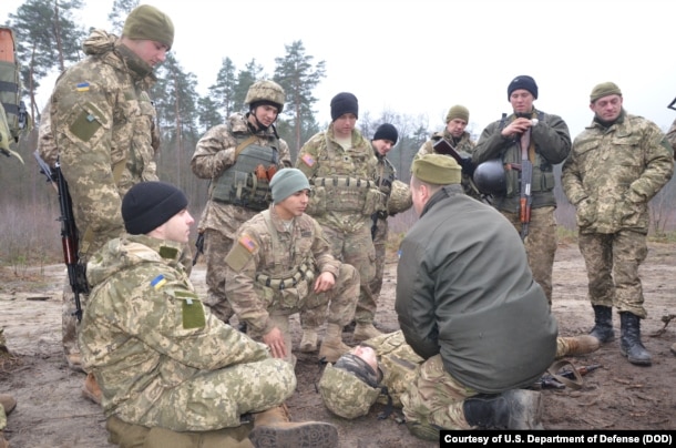 Ukrainian soldiers learn battle skills such as first aid from U.S. Army troops at the International Peacekeeping and Security Center in western Ukraine.