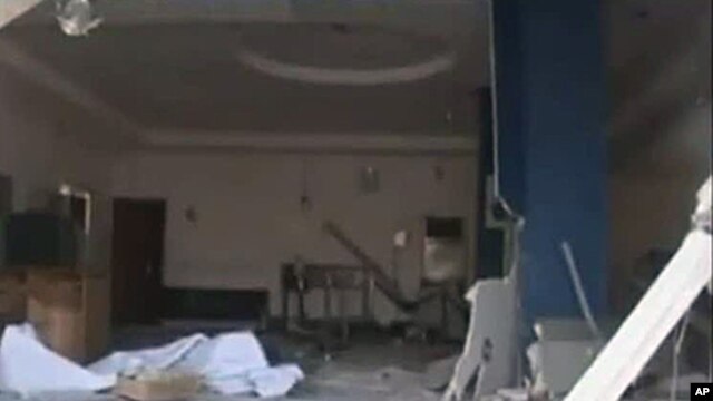 In this image made from television released by the state-run Nigerian Television Authority, Nov. 6, 2011, a damaged building is seen in Damatura, Nigeria, following a series of coordinated attacks Friday.