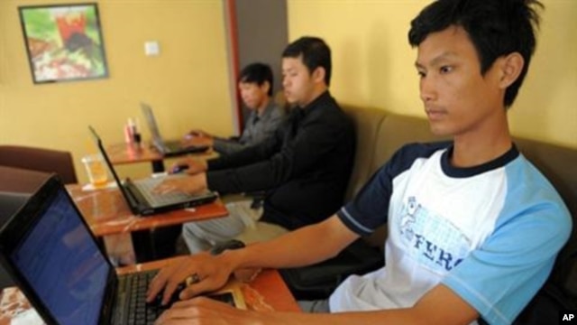 Cambodians surf the Internet at a coffee shop in Phnom Penh.