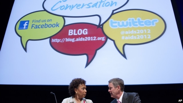 Rep. Barbara Lee, D-Calif., left talks with former Senate Majority Leader Bill Frist before a session at the XIX International AIDS Conference in Washington, July 25, 2012.