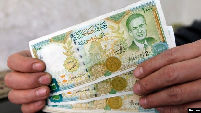 The Syrian pound is plunging in value on the black market, trading this past week for more than 300 to a U.S. dollar.