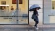 FILE - A woman is seen walking past a hair salon in Paris, Nov. 14, 2014. A Paris court on Friday acquitted a hair salon manager of homophobia in a case of an alleged gay slur she used about a homosexual employee.