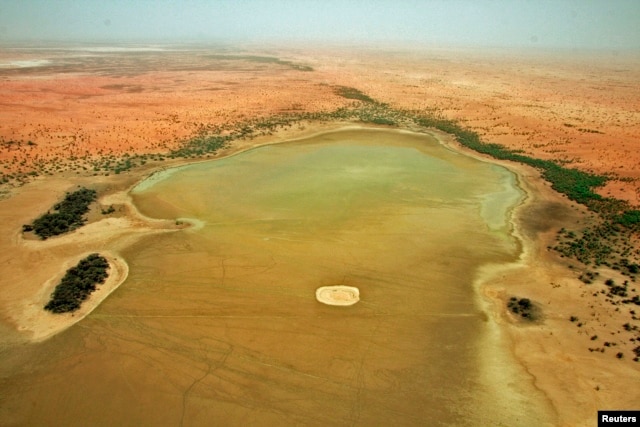 An aerial view of the dried up Lake Banzena in the drought-stricken Gourma region of Mali, May 24, 2009.