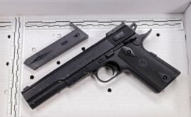 FILE - The fake handgun taken from 12-year-old Tamir Rice is displayed in November 2014 after a news conference in Cleveland.