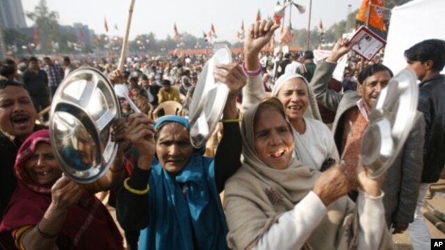 Supporters of India's main opposition National Democratic Alliance  protest in the capital, New Delhi, Dec. 22, 2010.