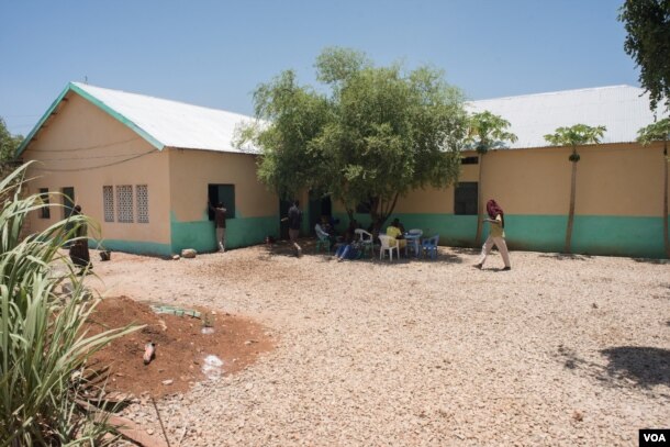 Former Al-Shabab members sit for lunch at a rehabilitation center for former militants in Baidoa, Somalia on September 17, 2016.