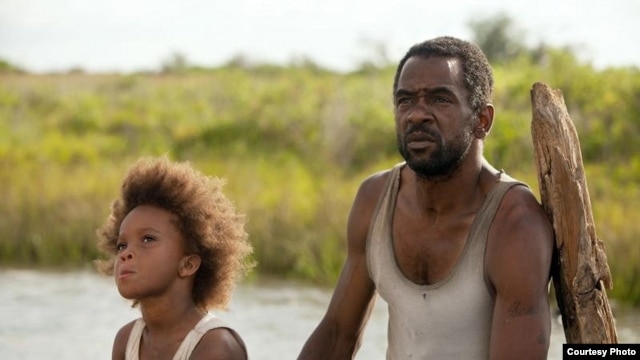 Quvenzhane Wallis as "Hushpuppy" and Dwight Henry as "Wink" on the set of Beasts of The Southern Wild (Photo: Fox Searchlight / Mary Cybulski)