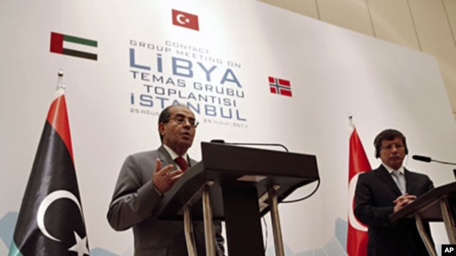 Libyan rebel leader and senior member of Libya's National Transitional Council (NTC) Mahmoud Jibril, speaks during a joint news conference with Turkey's FM Ahmet Davutoglu (R) in Istanbul, August 26, 2011