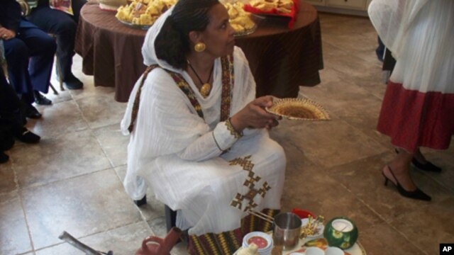 Anyalem Barayes prepares to conduct a traditional Eritrean coffee service.