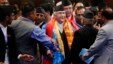 FILE - Nepal’s prime minister, Khadga Prasad Oli, center, speaks with members of his cabinet inside the Constituent Assembly in Kathmandu, Nepal, Oct. 11, 2015.