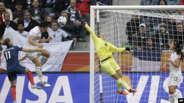 United States' Abby Wambach scores her side's second goal during the semifinal match between France and the United States at the Women's Soccer World Cup in Moenchengladbach, Germany,  July 13, 2011