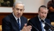 Israel's Prime Minister Benjamin Netanyahu (L) speaks during the weekly cabinet meeting in Jerusalem, May 19, 2013. 
