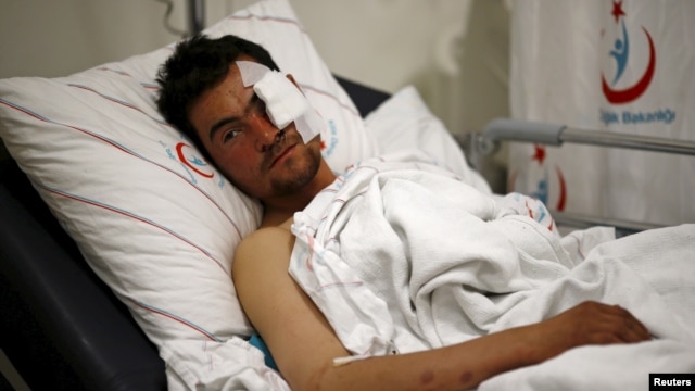 Kasim Genco, 21, a fighter with the Syrian opposition who was wounded during airstrikes on Syrian villages near the Turkey border, lies in his hospital bed in the southeastern city of Kilis, Turkey, Feb. 7, 2016. 
