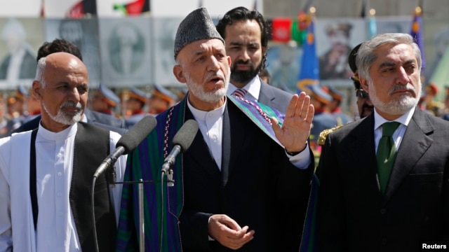 Afghan President Hamid Karzai, center, calls for resolution in presidential election. He's flanked by candidates Ashraf Ghani, left, and Abdullah Abdullah in Kabul Aug. 19, 2014.