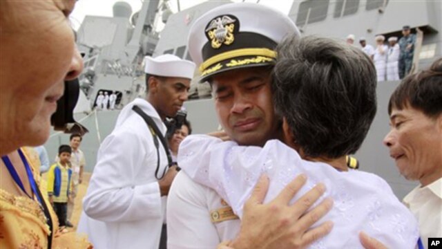 U.S. navy officer Michael "Vannak Khem" Misiewicz becomes emotional as he embraces his aunt Samrith Sokha, 72, at Cambodian coastal international sea port of Sihanoukville, file photo. 