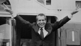 Richard Nixon says goodbye to members of his staff outside the White House as he boards a helicopter for Andrews Air Force Base after resigning the Presidency, August 9, 1974.