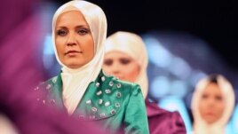 Models wear creations by a Turkish Islamic fashion house for its spring-summer 2008 ready-to-wear collection in Ankara, Turkey, Monday, March 3, 2008.