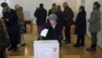 A woman casts her ballot at a polling station during the presidential election in Zagreb December 28, 2014. Croats were voting for a new head of state on Sunday but none of the four candidates for the largely ceremonial post in the European Union's newest