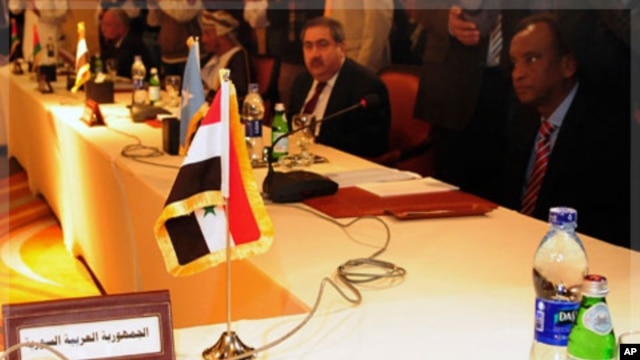 The seat of the Foreign Minister of Syria is seen empty during a meeting for Arab foreign ministers in Cairo, to discuss the situation in Syria, November 24, 2011.