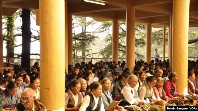 Tibetans Praying at Tsunglagkhang in Dharamsala