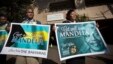 A group of wellwishers hold up get-well placards outside the entrance to the Mediclinic Heart Hospital where former South African President Nelson Mandela is being treated in Pretoria, June 16, 2013. 