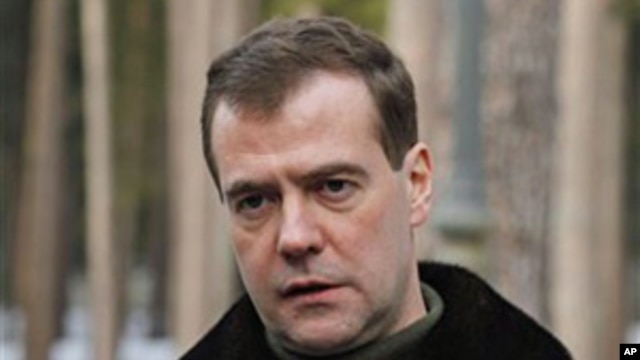 Russia's President Dmitry Medvedev speaks to the media at the Gorki residence outside Moscow, March 21, 2011