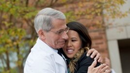 Dr. Anthony Fauci hugs Nina Pham as she's discharged from the National Institutes of Health, Oct. 24, 2014.