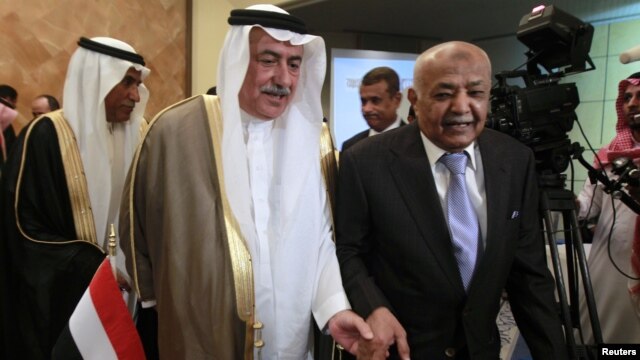 Yemen's Prime Minister Mohammed Salem Basindwa, right, with Saudi Arabia's Finance Minister Ibrahim al-Assaf at international donor meeting, Riyadh, Sept. 4, 2012.