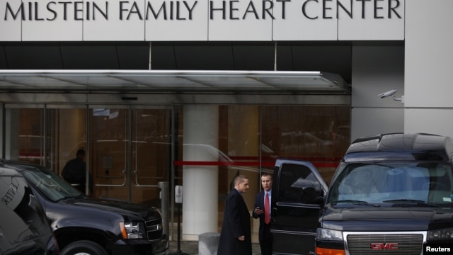 Members of the Secret Service stand outside  New York-Presbyterian Hospital where U.S. Secretary of State Hillary Clinton remains hospitalized, January 1, 2013. 