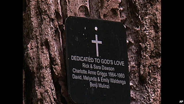 A small bronze plaque on the tree lists the people buried there as well as their dates of birth and when they died.