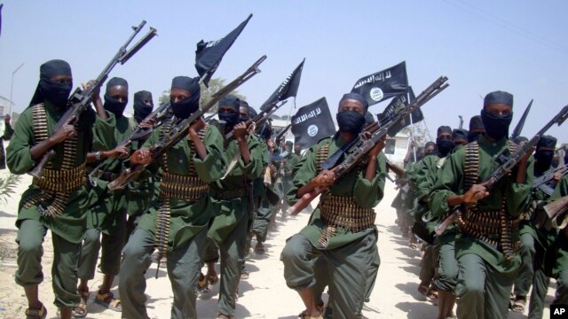 FILE - Al-Shabab fighters are seen marching with their weapons during exercises on the outskirts of Mogadishu, Somalia, Feb. 17, 2011. The Pentagon says a U.S. airstrike against al-Shabab in Somalia last Saturday killed more than 150 militants.