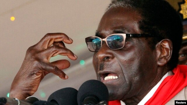 Zimbabwe's President Robert Mugabe gestures as he speaks during an event marking his 89th birthday in Bindura, about 90 km north of the capital Harare Mar. 2, 2013. 