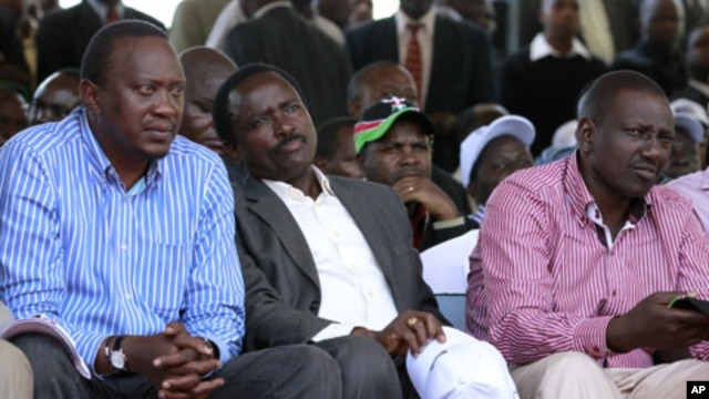 Kenya's Finance Minister Uhuru Kenyatta (L), Kenya's Vice President Kalonzo Musyoka (C) and suspended Higher Education Minister William Ruto (R) attend a prayer meeting at the Uhuru Park grounds in the capital Nairobi, April 11, 2011.